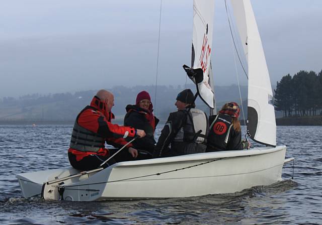 Despite the poor autumn weather, new members enjoy a training session in the RS Visions. 
