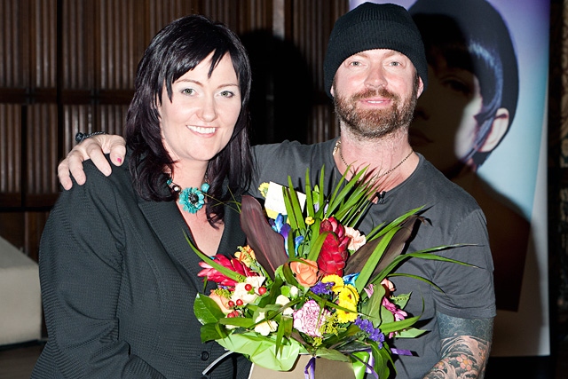 Lee Stafford presents event organiser Becky Lee with a bouquet of flowers