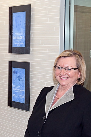 GMPA Vice Chairwoman Christine McGawley next to the two ceremonial plaques<br/>Rochdale Divisional Headquarters official opening 