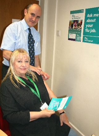 Councillor Robinson receives her annual flu vaccination from Dr Duffy