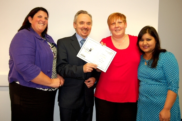 David Edwards, Acting Chair, presents Amanda Clegg with her Going for Gold Stars award, along with nominators Karen Hurley and Tanveer Kausser.