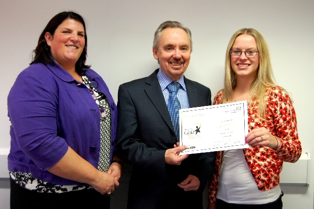 David Edwards, Acting Chair, presents Ashley Hill with her Going for Gold Stars award, along with nominator Karen Hurley.