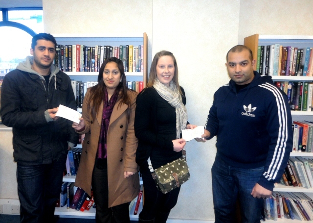 Mohammed Nadeem and Masoon Elahi from AGG handing the grants to Keri Aldritt and Farhana Naz