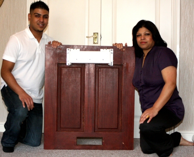 Adeel and Zahida with their letterbox cover
