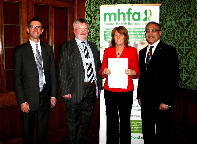 Tricia Hornby CEO of Rochdale & District Mind collecting the MHFA champions award from Simon Western OBE, Professor Lord Patel OBE & Nigel Jones, Partner and Co-Head of Healthcare sector Linklaters  LLP 
