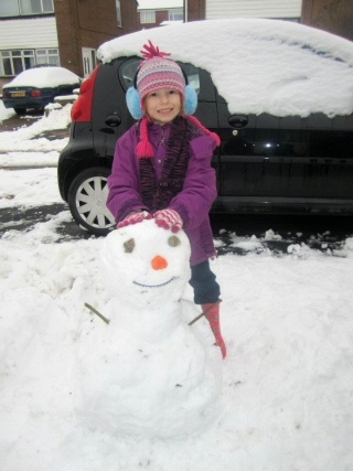 Isobel Conway, age 6, with her snowman