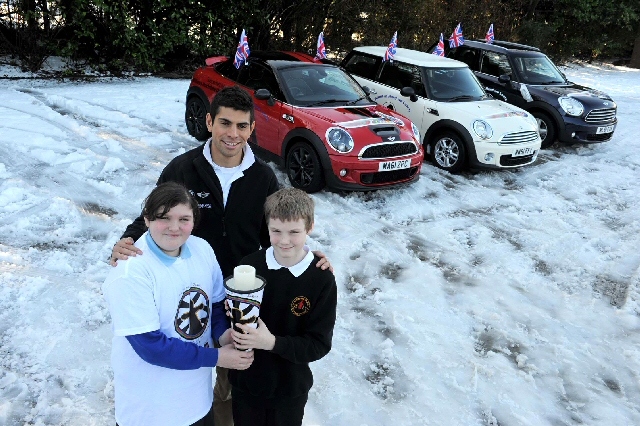 Tom Lancashire with Faye Stafford  and Luke Stott in the passing over of the Olympic Torch Relay of Prayer