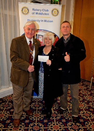 Rotary Club of Middleton President John Brooker with representatives from STATUS