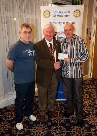 Rotary Club of Middleton President John Brooker with representatives from Middleton Athletic Ladies Team