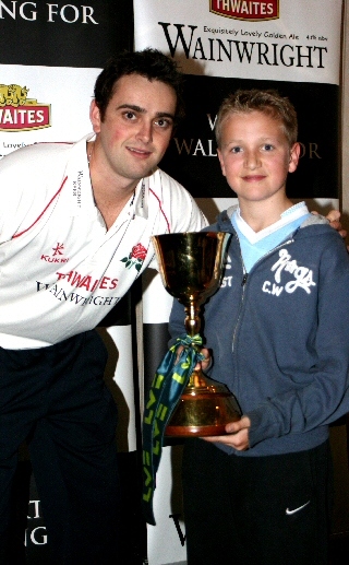 A cricket fan with Stephen Parry and the County Championship Trophy