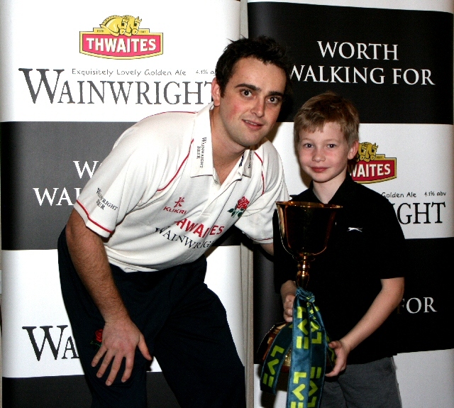 A cricket fan with Stephen Parry and the County Championship Trophy