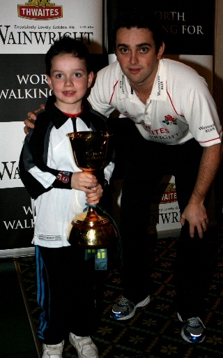 A cricket fan with Stephen Parry and the County Championship Trophy