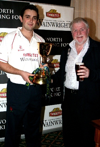 Allen Brett, Milnrow Cricket Club, with Stephen Parry and the County Championship Trophy