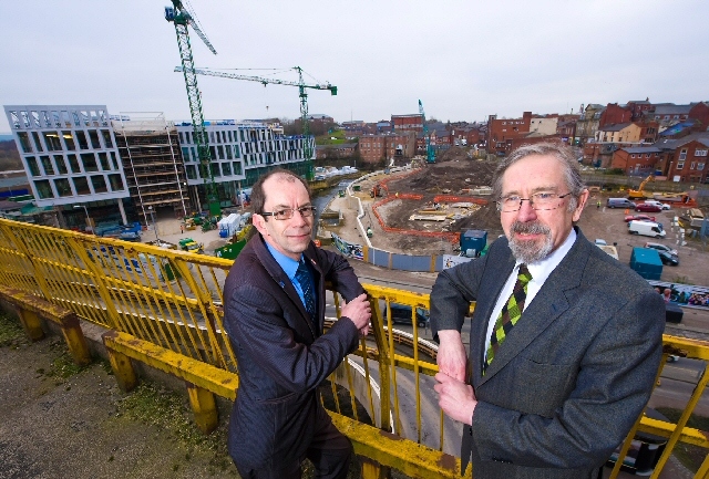 Councillor Andrew Fender and Councillor Colin Lambert overlooking the interchange site (centre) and Number One Riverside (left)