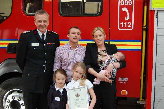 CFO Steve McQuirk with Craig Berrisford and his wife Joanne, baby daughter Elsie-Jo, Annalise, aged 9 (holding the certificate), and Sienna, aged 6.