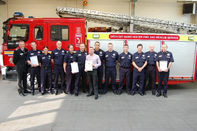 CFO Steve McQuirk with Craig Berrisford (centre) and the crews from Heywood and Rochdale