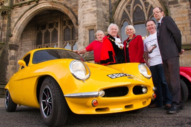 The Mayor Alan Godson and Mayoress Gillian Brown are pictured alongside one of the Rochdale Olympic cars with Council Leader, Colin Lambert (right) and members of the Rochdale Owners Club. 
