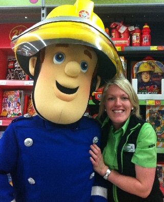 Asda employee Nicola Smith (pictured with Fireman Sam) will carry the Olympic Torch in Lancaster