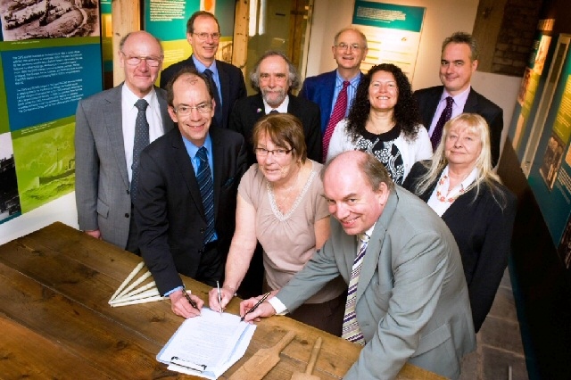 Representatives from Rochdale Borough Council, RBH and the Tenants’ Panel sign the transfer agreement at the Toad Lane Pioneers Museum in Rochdale