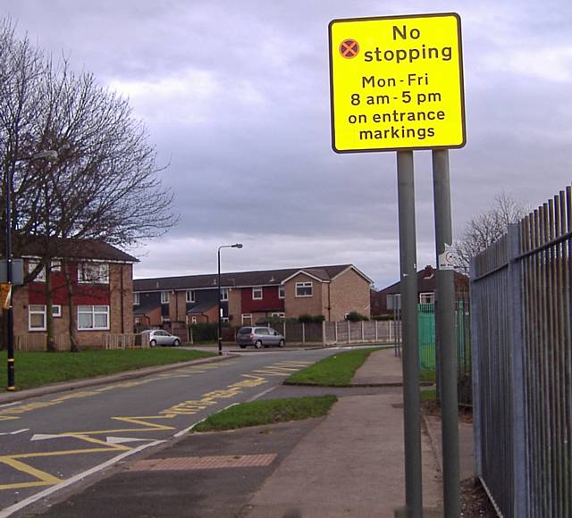 NO PARKING… road markings outside a school

