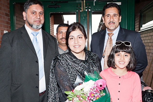 Baroness Warsi is greeted on arrival at Deeplish Community Centre with flowers