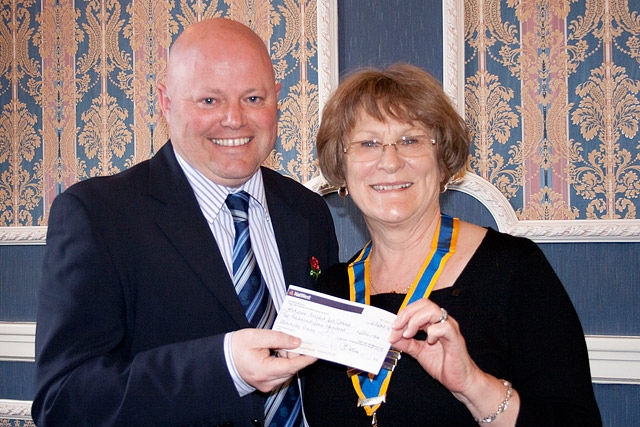 Bobby Denning of Lancashire Cricket Board presented with a cheque by Rochdale Rotary Club President Joan Banks