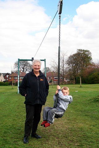 Councillor Pat Colclough with local young Kirkholt resident Leyton Ramsden from Kildare Crescent at the Zip Wire at Balderstone Park