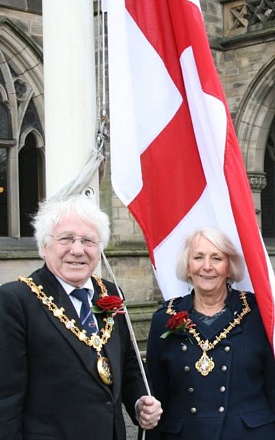 The Mayor, Councillor Alan Godson, and Mayoress, Gillian Brown, with the flag of St George outside Rochdale Town Hall