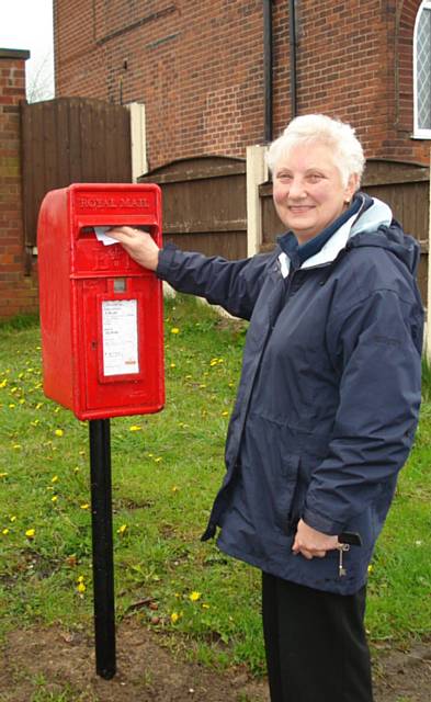 Cllr Pat Colclough next to the Post Box in Hartley Lane 