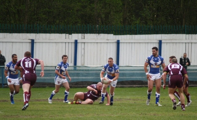 Danny Moran looks for the gap against Millom