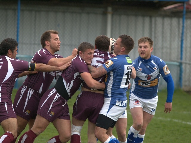 Strong defence against Millom