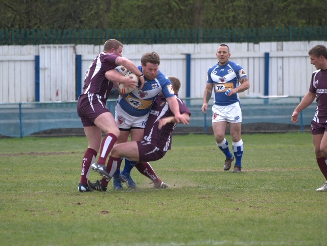 Aiden Gleeson tackled by Millom