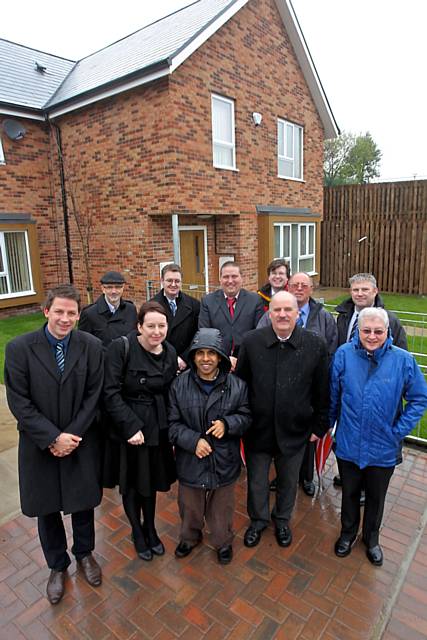 Nick Stevenson, Development Officer at Regenda; Tracy Heyes, Executive Director of Operations at Regenda; Kamal Chowdury, resident; Peter Maynard, Housing Standards Manager, Rochdale Council; Les Wright, Neighbourhood Officer at Regenda; (back row) John Cooke (Pozzoni Architects); Ken Davies, Clerk of Works at Regenda; Jon Cousins, Director at CSC Construction; Phil Morris (Pozzoni Architects; Roland Couzens, CSC Construction; Peter Marshall (Regenda’s Employers Agent)