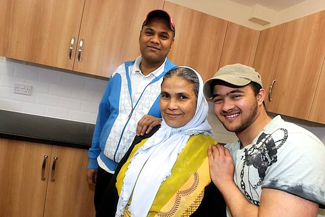 Raja Miah with his mother Afia Begum, who has just moved into her new home in Ramsay Street, and his brother Noir Miah