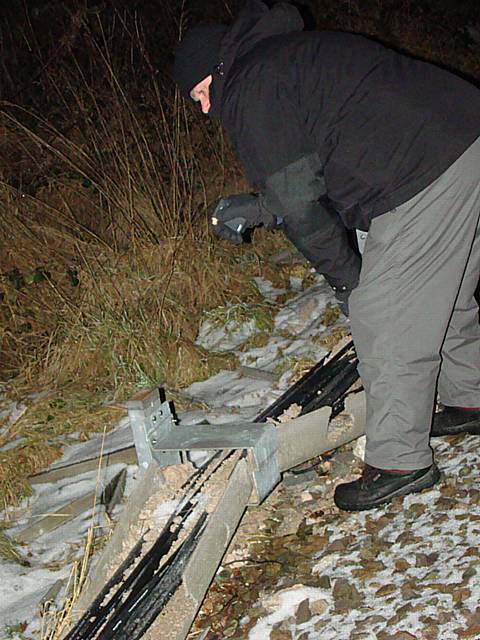 A BTP officer examines damaged cable 