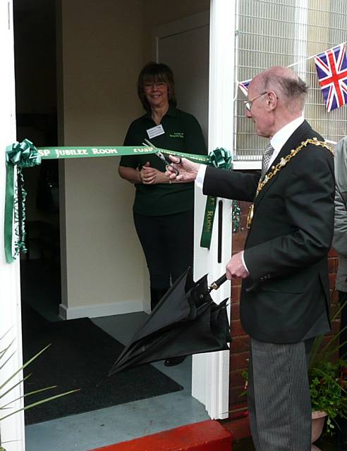 The Mayor, Cllr. James Gartside cuts the ribbon at the Springfield Park Jubilee room