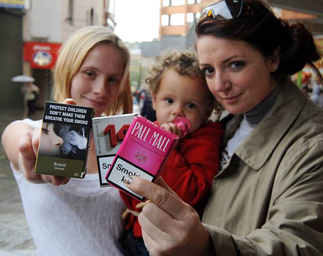 Local mum Jolene Jenkinson (left) with daughter Lucie (centre) from Rochdale pledges to help future generations by supporting plain cigarette packaging with the help of a member of the plain packaging engagement team Kimberley (right)