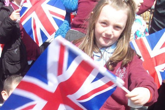 Louise flying her flag for the Queens visit to Burnley