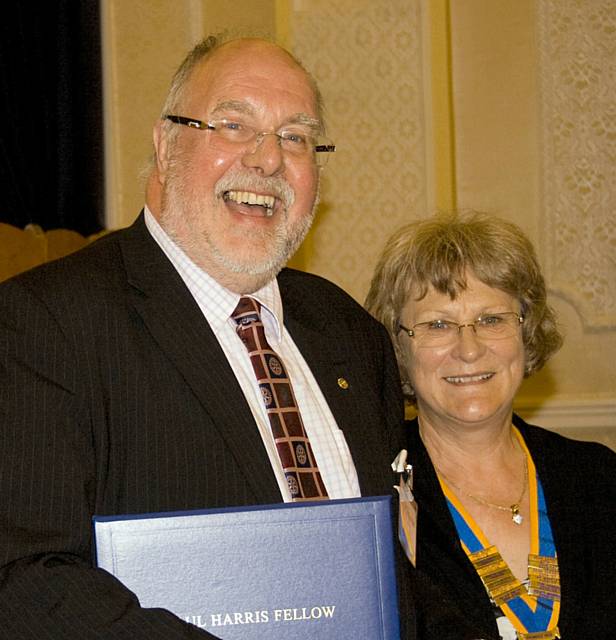 John Kay receives the Paul Harris Fellowship award from President Joan Banks      