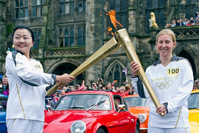 Wensheng Li and Amy Peckover at the Olympic Flame hand over in Rochdale Town Centre