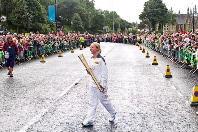 Amy Peckover and a massive crowd of thousands await the arrival of the Olympic Flame