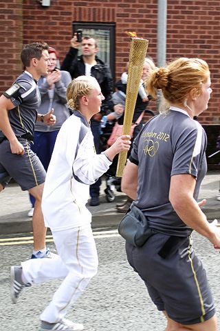 Jodie Mcnamara running with the Olympic Torch in Heywood 