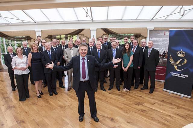 UKTI North West Director Clive Drinkwater with the winners of the Queens Award for International Trade 2012