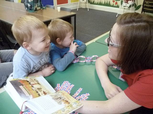 Centre Worker Michelle Wood reads the story of Noah’s Ark to a captivated audience