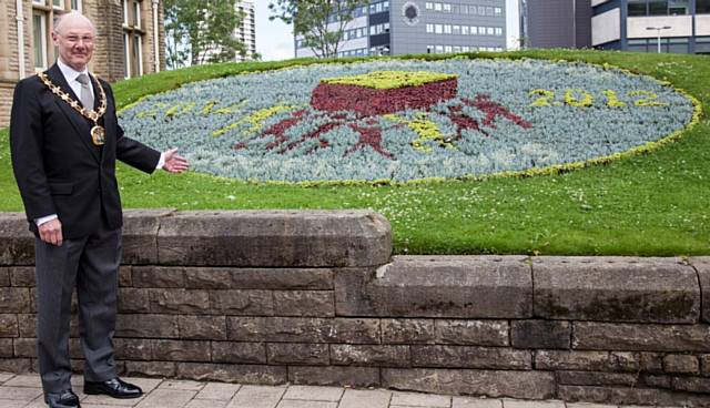 The Mayor at the International Year of Co-operatives flowerbed outside Touchstones 
