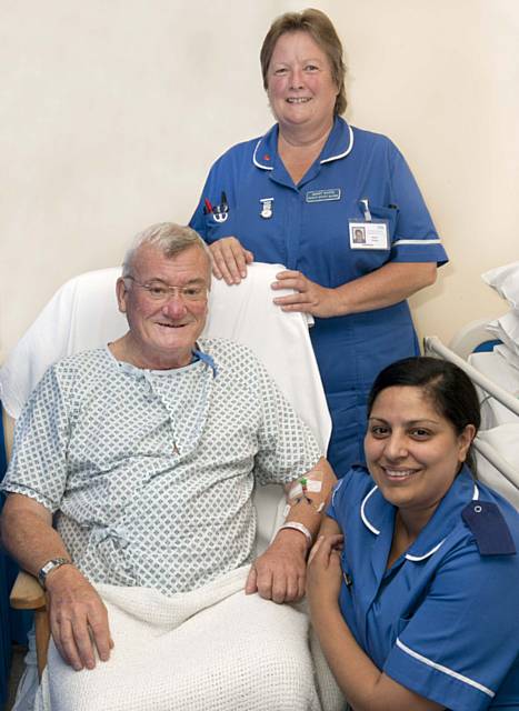 Patient Councillor David Barnes, Mayor of Whitworth, with Wendy Wood, staff nurse, and Sister Naheed Sabir