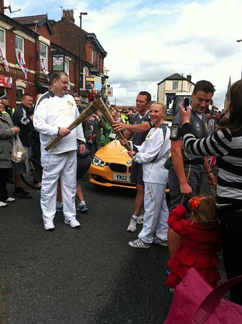 Jodie Mcnamara with the Olympic Torch in Heywood 