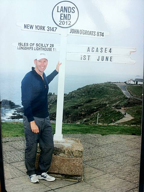 Paul Sheerin at the start of his mammoth charity trek from Land’s End to John O’Groats - with nothing but the sign on his back