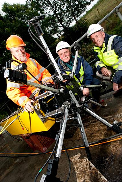 Flow go gadget gizmo: From left, Director of Water Services Group Paul Hope-Darby and United Utilities' Derek Shaw and Steve Hazon