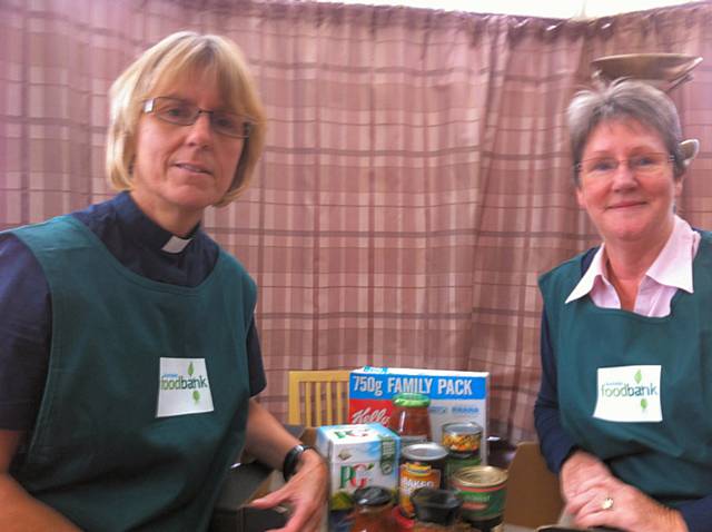 Rev Sharon Jones and Margaret Wight with some food already collected for the Foodbank